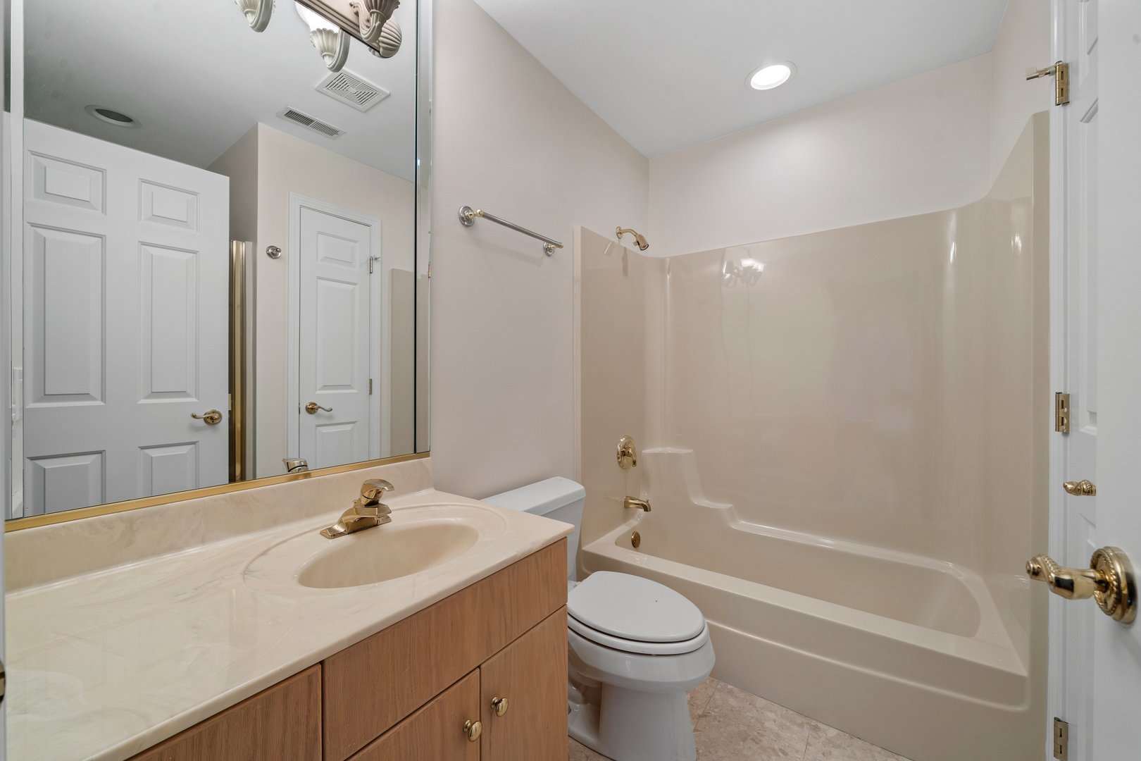 34W336 Country Club Road Wayne, IL 60184 - Photo 22 of 32 a bathroom with a sink toilet a tub and shower