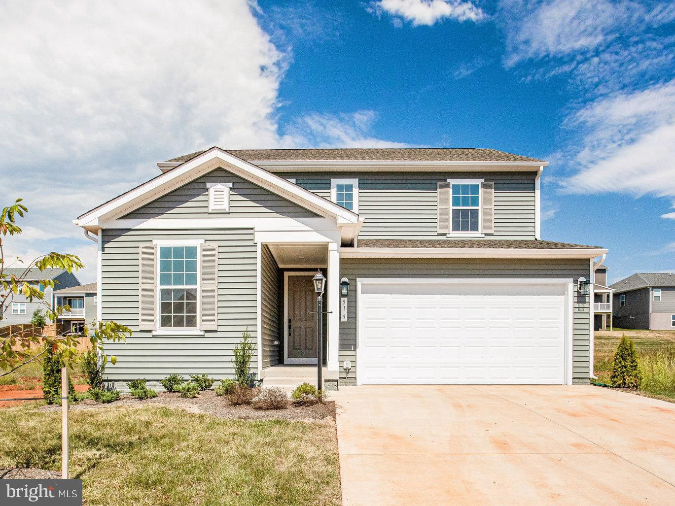 a front view of a house with a garage