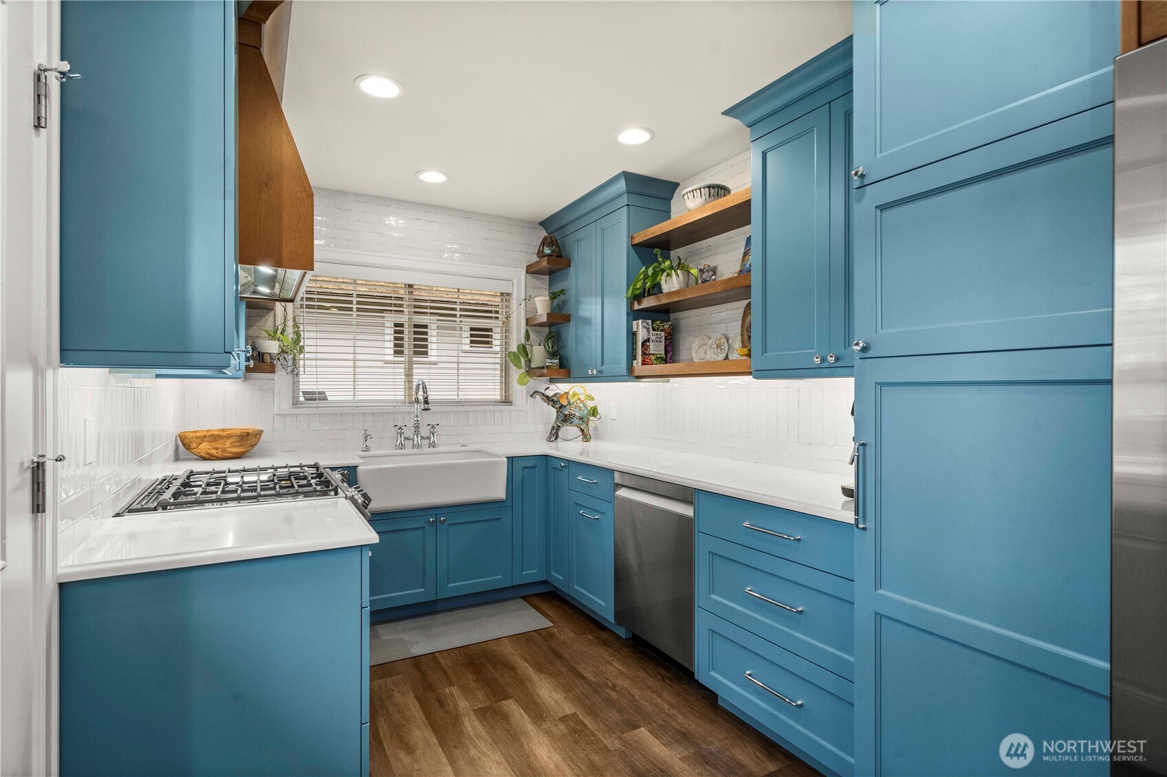 1001 South Prospect Street Tacoma, WA 98405 - Photo 18 of 40 a kitchen with a refrigerator and a stove top oven