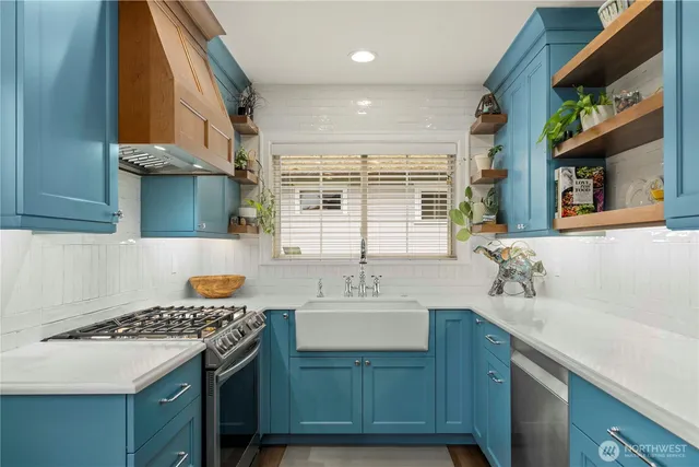 a kitchen with a sink stove and cabinets
