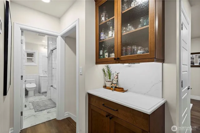 a bathroom with a sink a mirror and a shower