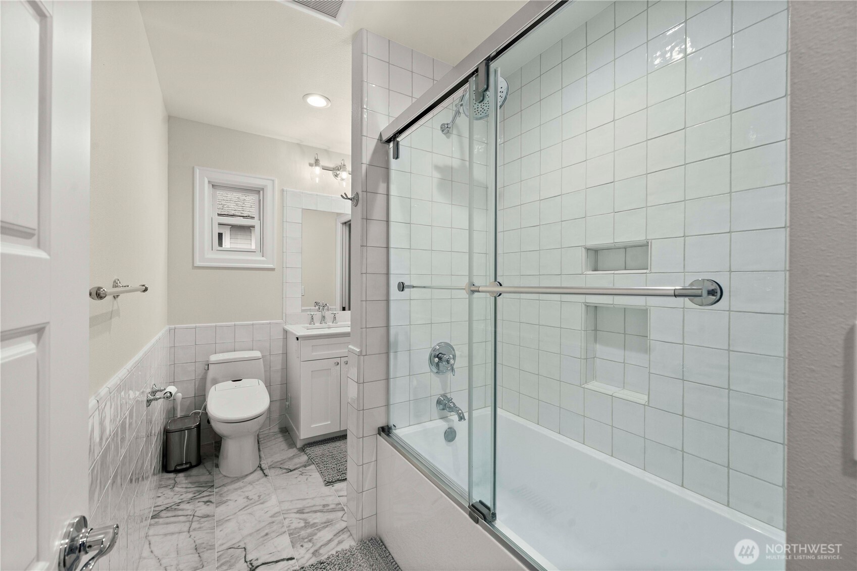 1001 South Prospect Street Tacoma, WA 98405 - Photo 24 of 40 a bathroom with a granite countertop toilet a sink and bathtub