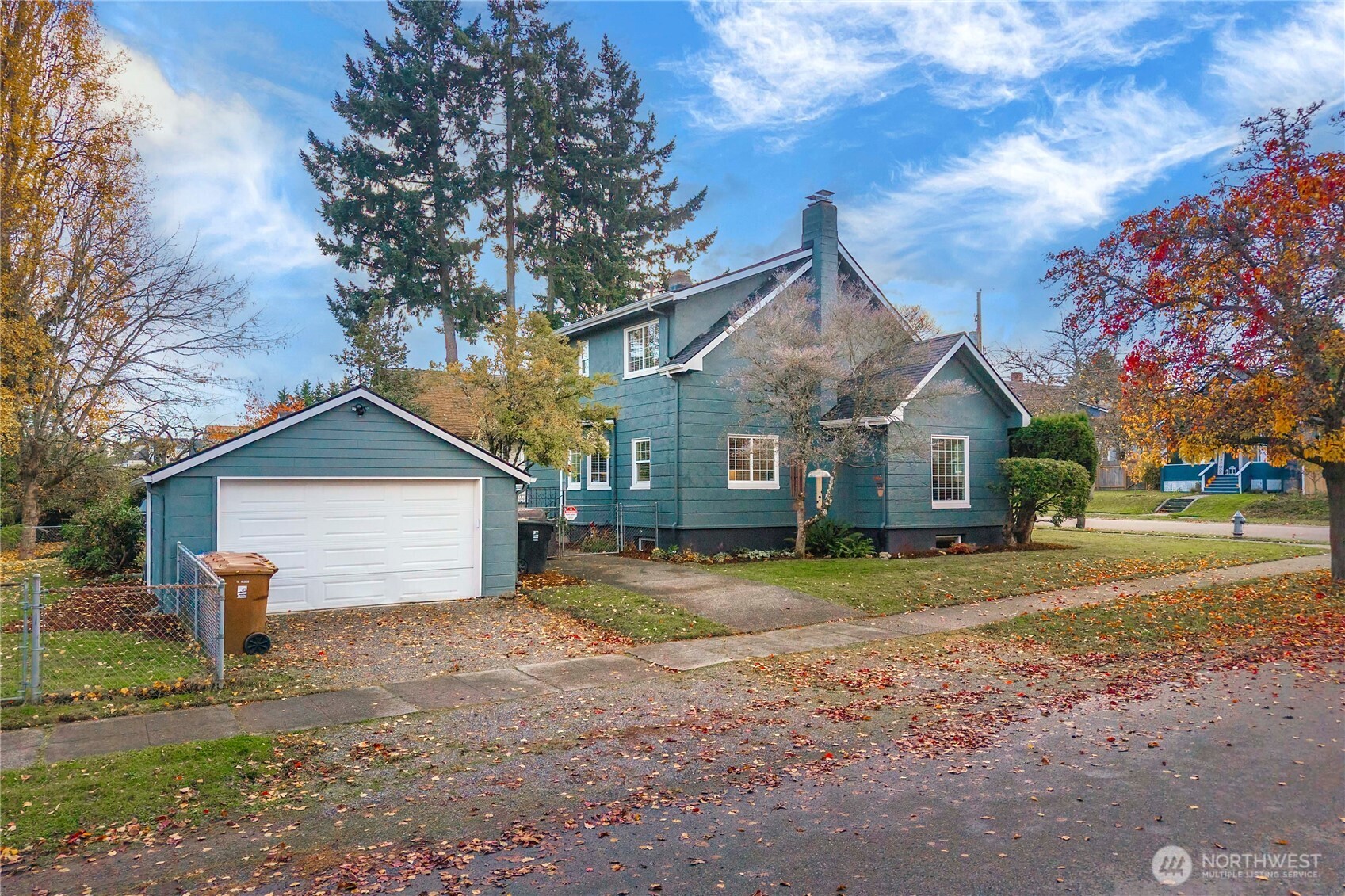 1001 South Prospect Street Tacoma, WA 98405 - Photo 8 of 40 a front view of a house with a yard and trees