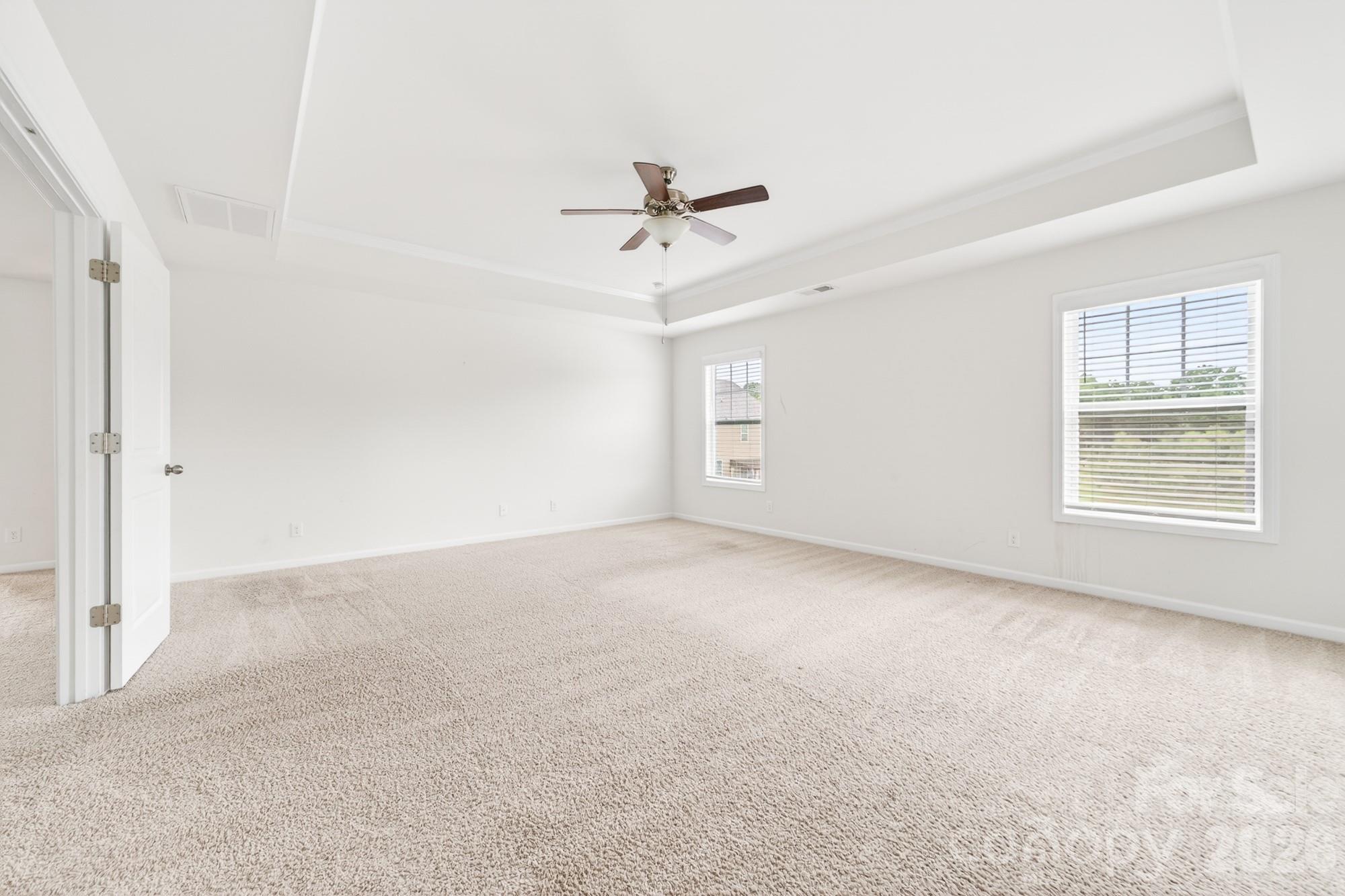 5972 Redwood Pine Road Concord, NC 28027 - Photo 23 of 37 an empty room with windows and fan