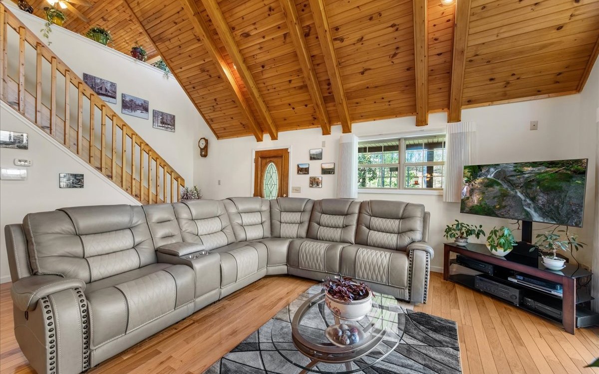 94 Mull Ln Circle Morganton, GA 30560 - Photo 17 of 67 a living room with furniture and a flat screen tv