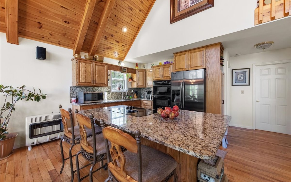 94 Mull Ln Circle Morganton, GA 30560 - Photo 20 of 67 a view of a dining room with furniture and wooden floor