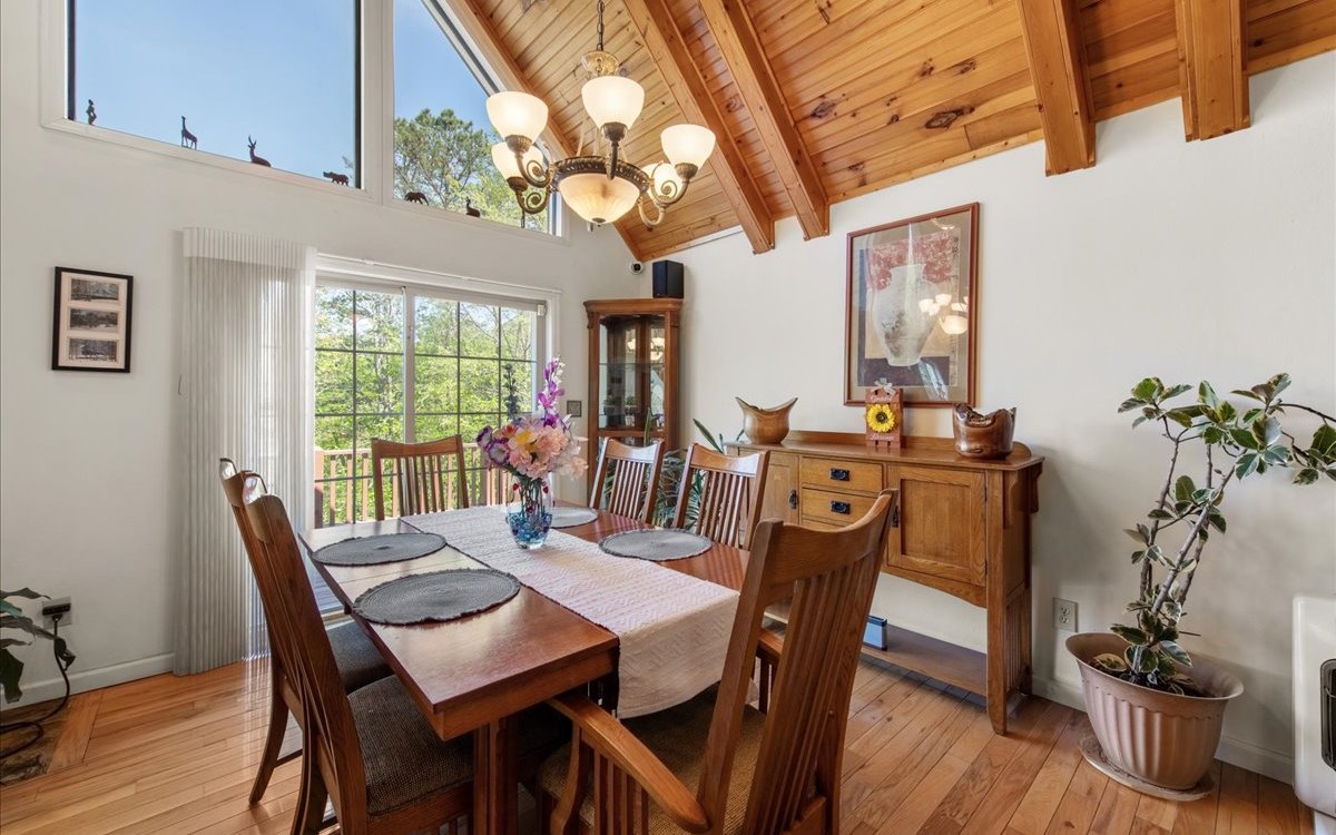 94 Mull Ln Circle Morganton, GA 30560 - Photo 26 of 67 a view of a dining room with furniture window and wooden floor