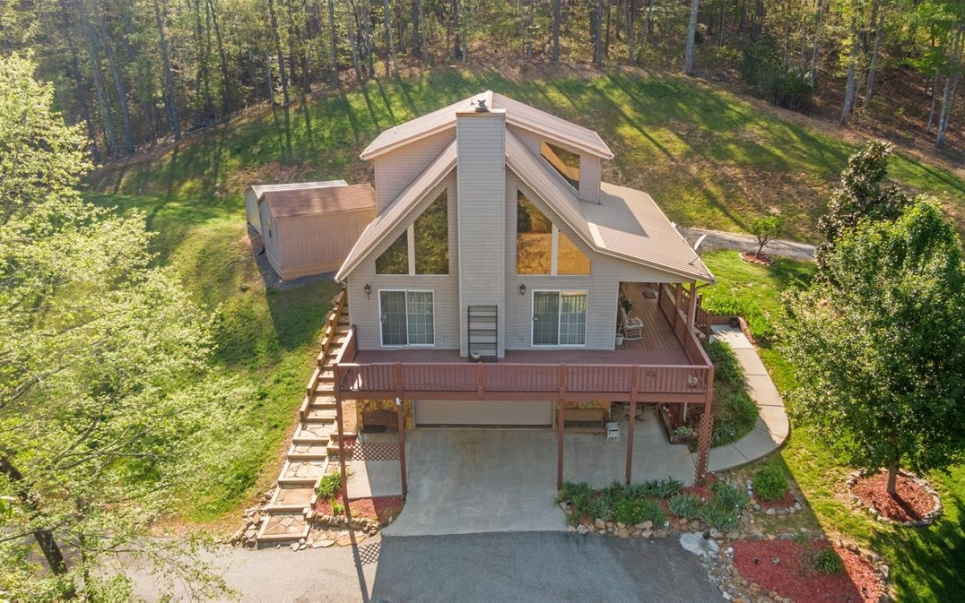 94 Mull Ln Circle Morganton, GA 30560 - Photo 3 of 67 a front view of a house with a garden