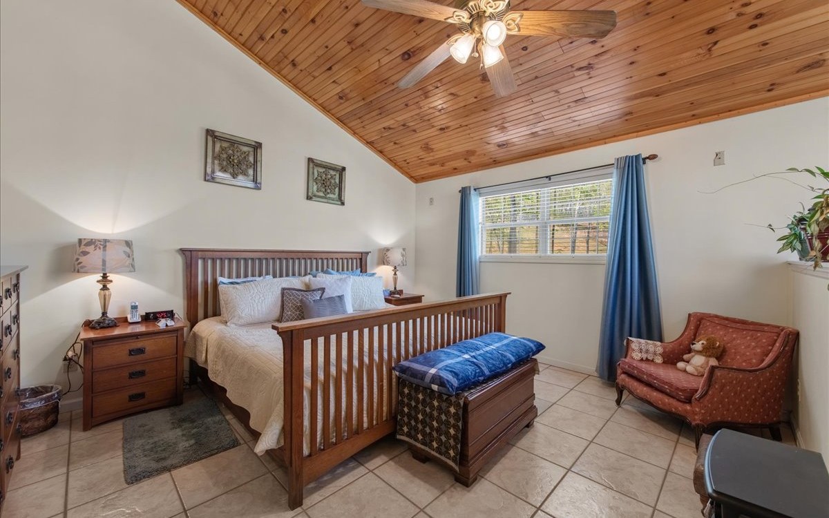 94 Mull Ln Circle Morganton, GA 30560 - Photo 32 of 67 a bedroom with furniture and a window