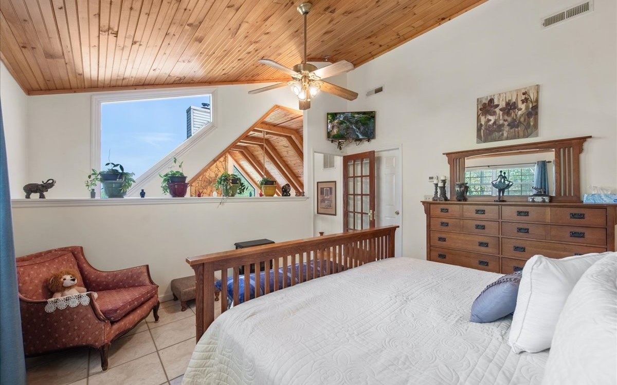 94 Mull Ln Circle Morganton, GA 30560 - Photo 33 of 67 a bedroom with furniture and a flat screen tv