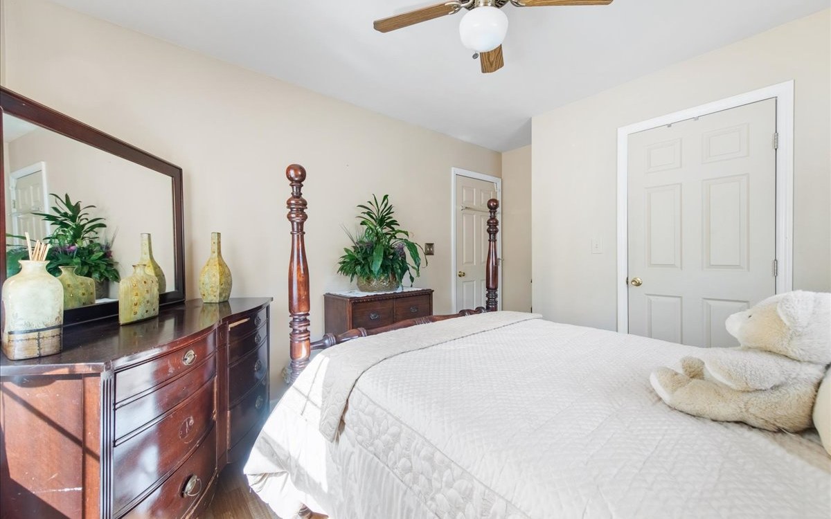 94 Mull Ln Circle Morganton, GA 30560 - Photo 38 of 67 a bedroom with a bed potted plant and a large mirror