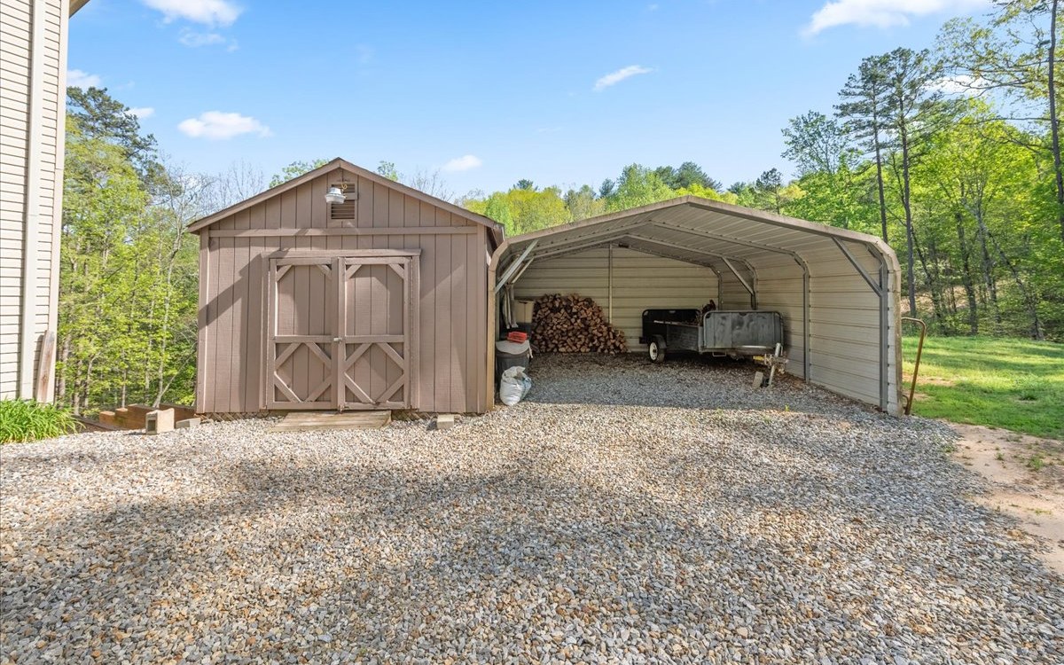94 Mull Ln Circle Morganton, GA 30560 - Photo 58 of 67 a front view of a house with garden