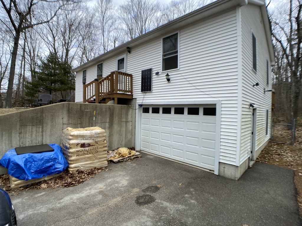 139 Union Road Wales, MA 01081 - Photo 11 of 15 a view of a white house with a sink and backyard