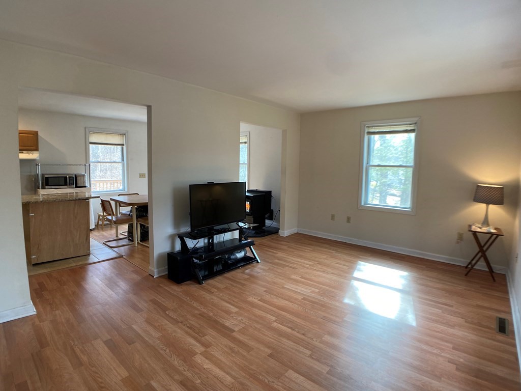 139 Union Road Wales, MA 01081 - Photo 2 of 15 a living room with furniture and a flat screen tv