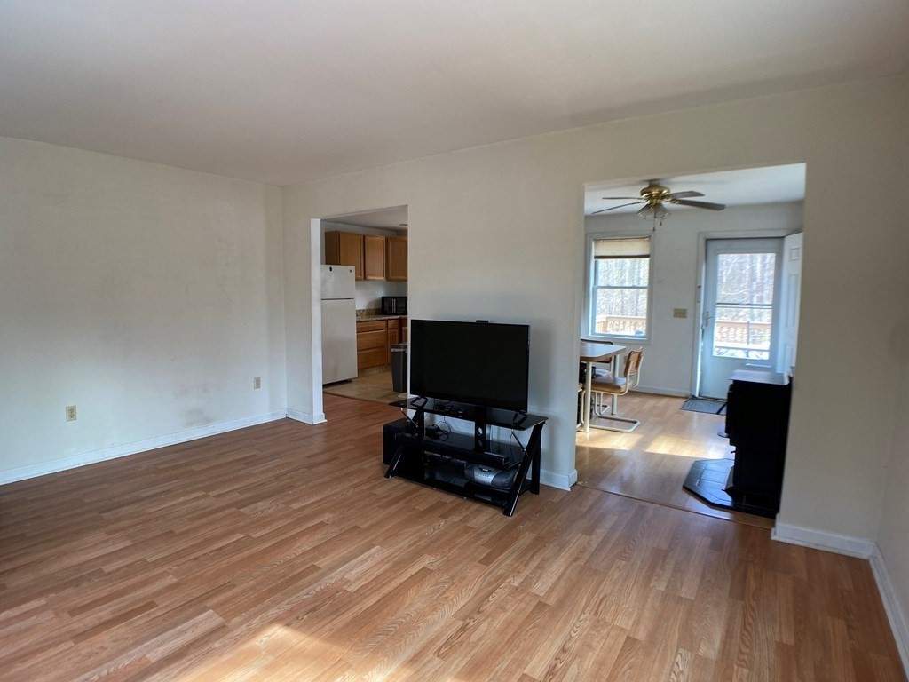 139 Union Road Wales, MA 01081 - Photo 3 of 15 a living room with furniture and a flat screen tv