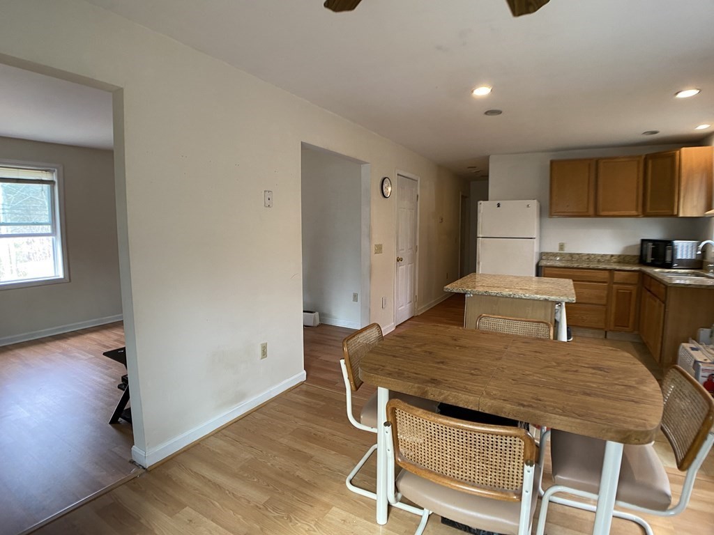 139 Union Road Wales, MA 01081 - Photo 6 of 15 a kitchen with a table and chairs in it