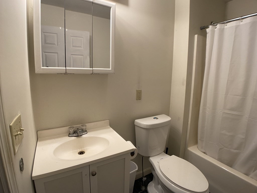 139 Union Road Wales, MA 01081 - Photo 7 of 15 a white toilet sitting next to a bathroom sink