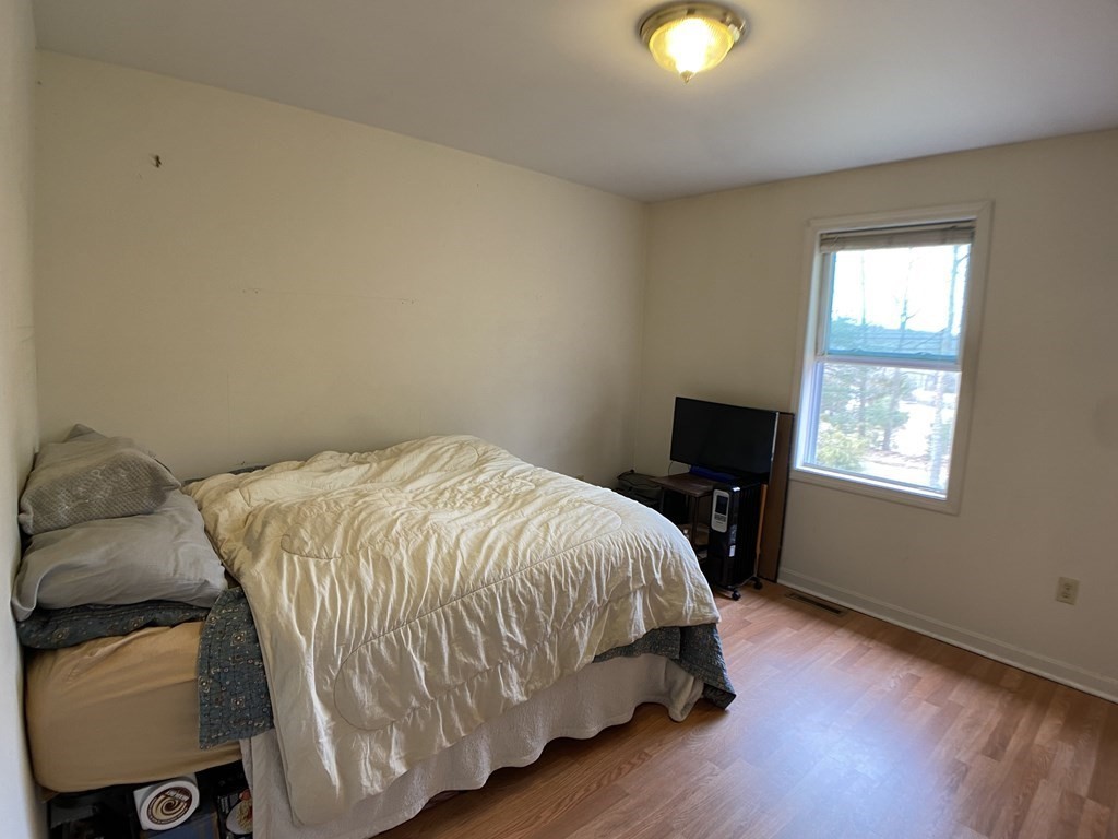 139 Union Road Wales, MA 01081 - Photo 8 of 15 a bedroom with a bed and window