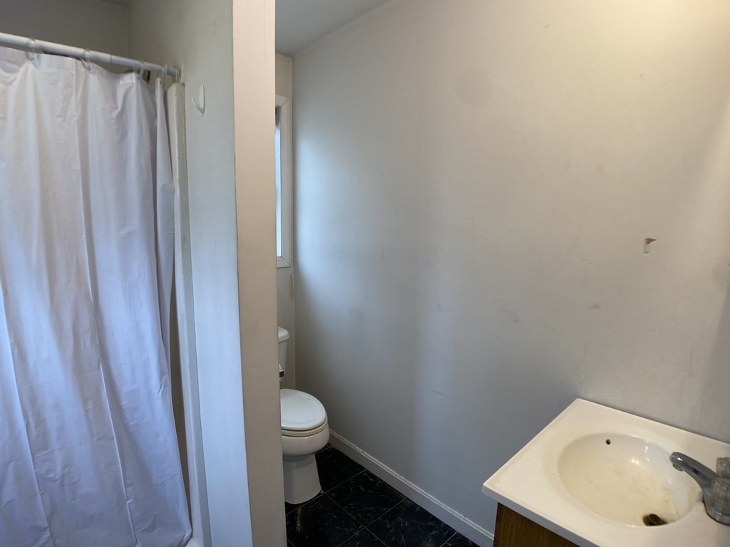 139 Union Road Wales, MA 01081 - Photo 10 of 15 a bathroom with a sink and toilet