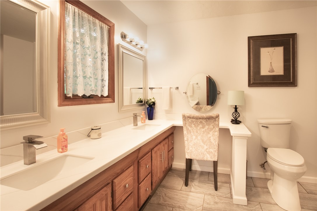 200 Chenault Road Townville, SC 29689 - Photo 24 of 47 Ample counter space and dual vanities enhance this well-appointed private bathroom.