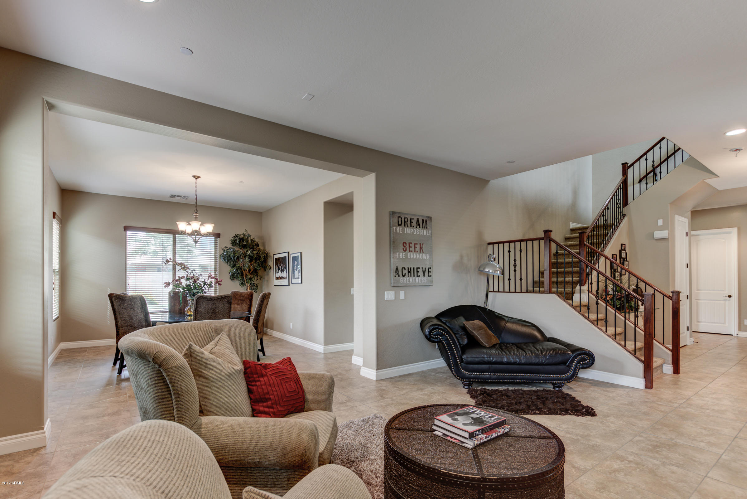 2906 East Blue Sage Road Gilbert, AZ 85297 - Photo 8 of 41 a living room with furniture and a lamp