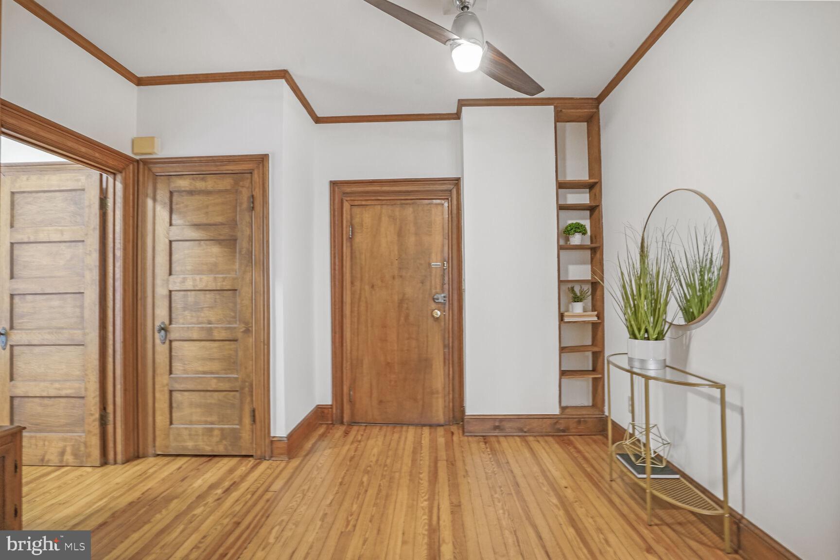 2022 Columbia Road Northwest, Unit 111 Washington, DC 20009 - Photo 4 of 43 wooden floor in a hall with an entryway
