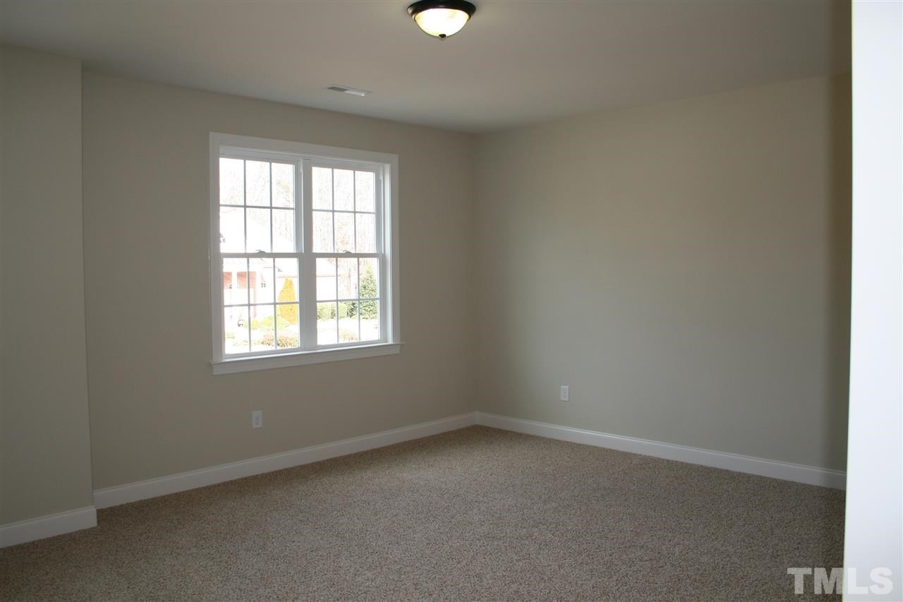 8605 Hurst Drive Raleigh, NC 27603 - Photo 13 of 17 an empty room with a window