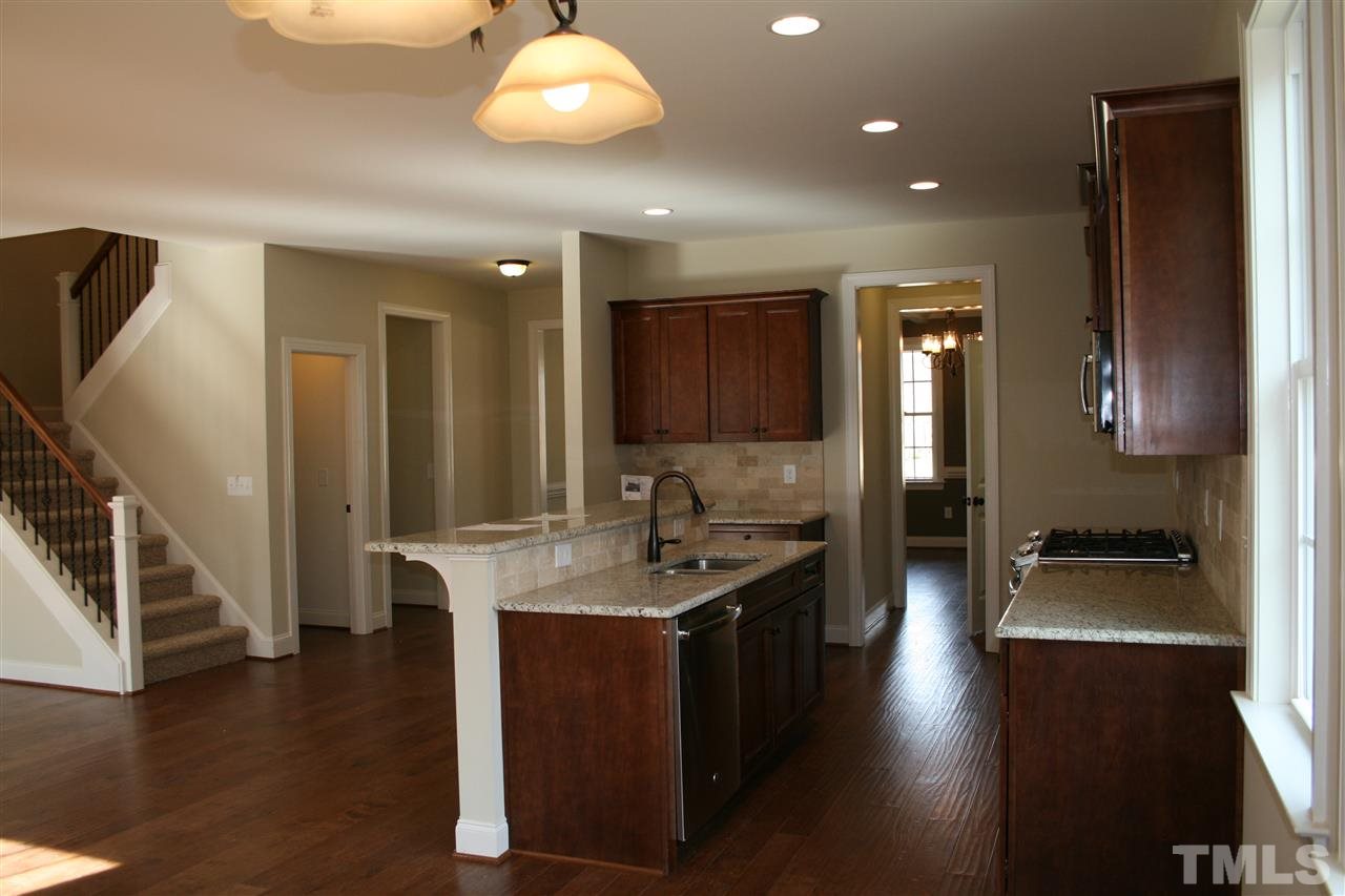 8605 Hurst Drive Raleigh, NC 27603 - Photo 3 of 17 a kitchen with sink stove and cabinets