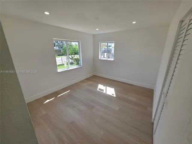 a view of empty room with windows