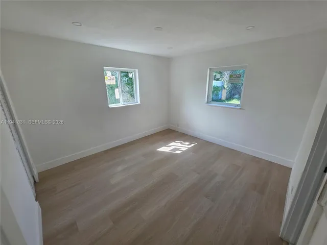 an empty room with windows
