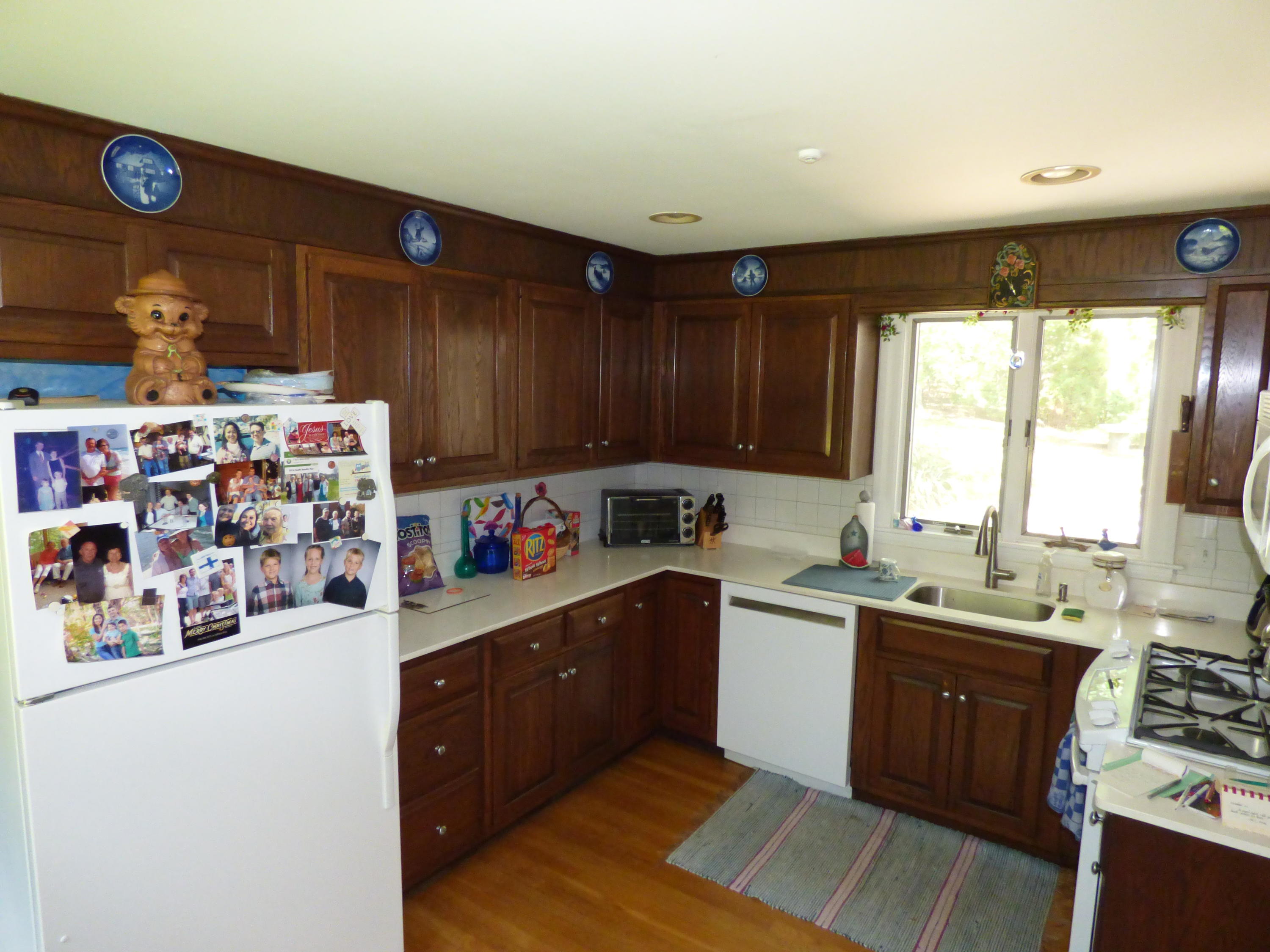 1415 Old Post Road Marstons Mills, MA 02648 - Photo 11 of 28 a kitchen with a sink a stove and cabinets