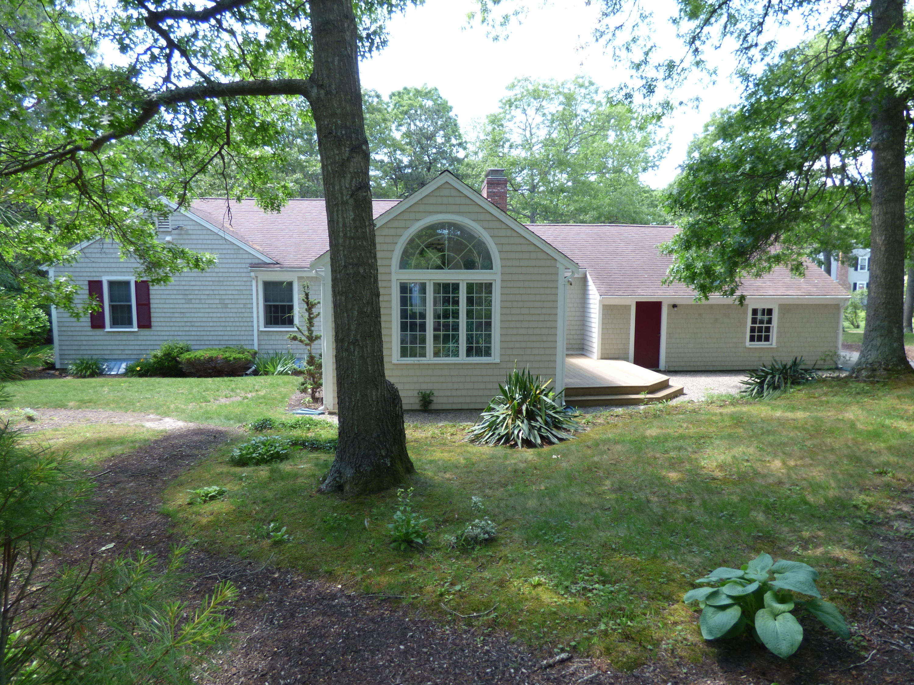 1415 Old Post Road Marstons Mills, MA 02648 - Photo 18 of 28 a front view of house with yard and green space