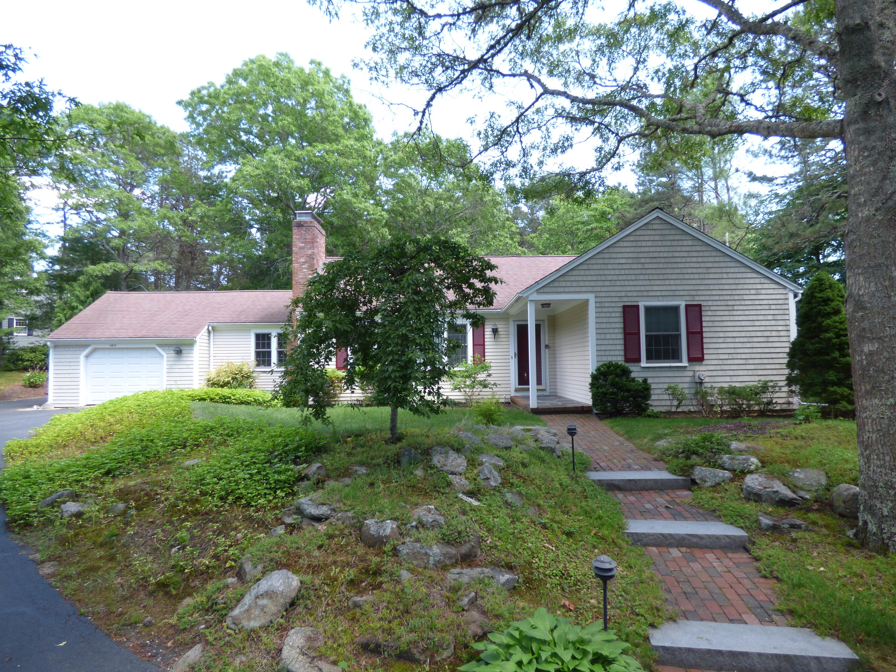 1415 Old Post Road Marstons Mills, MA 02648 - Photo 2 of 28 a front view of a house with a yard
