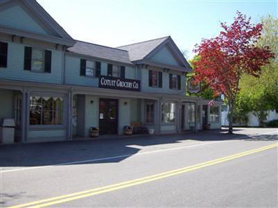 1415 Old Post Road Marstons Mills, MA 02648 - Photo 26 of 28 front view of a brick house with a small yard