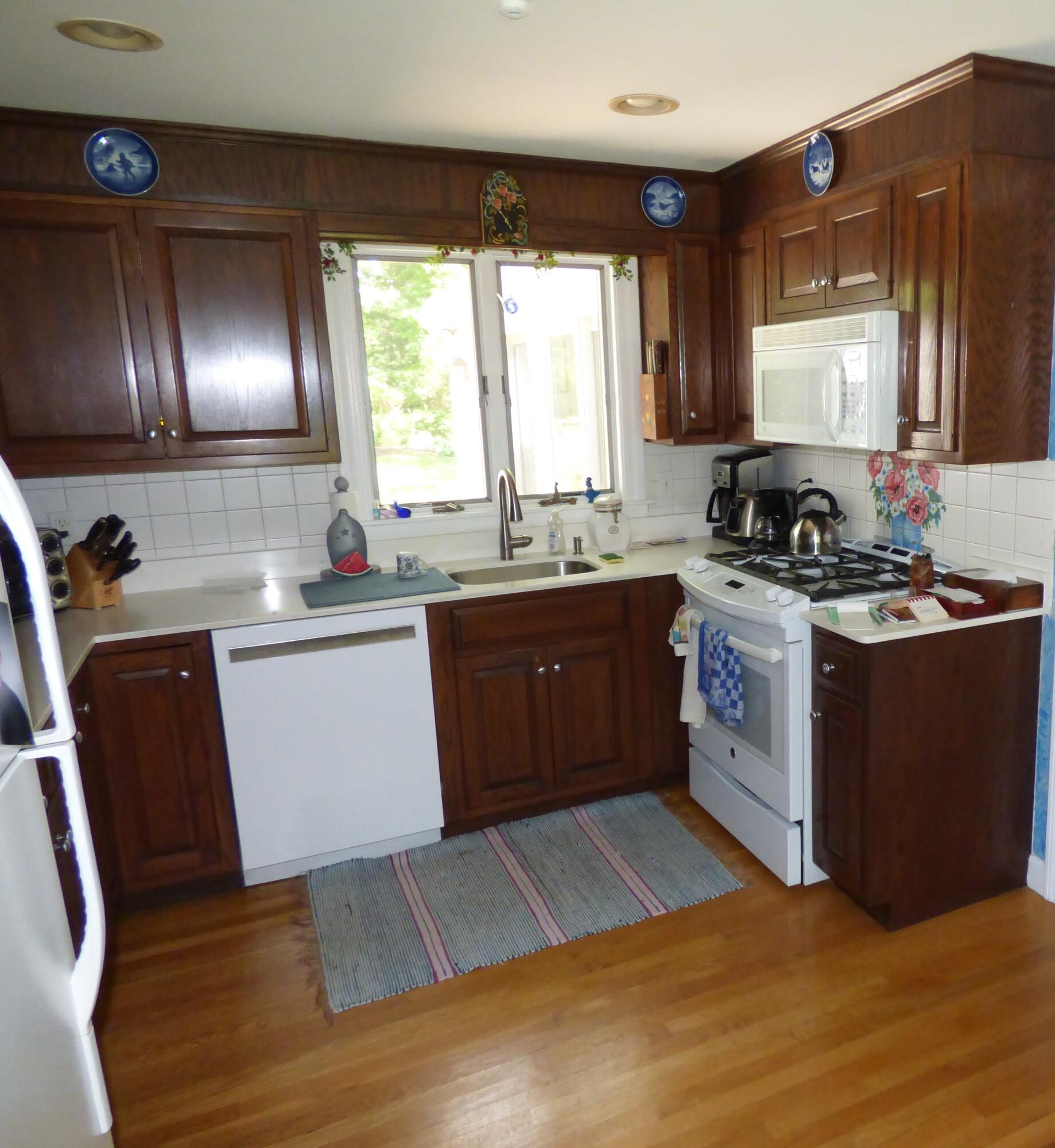 1415 Old Post Road Marstons Mills, MA 02648 - Photo 10 of 28 a kitchen with a sink stove and cabinets
