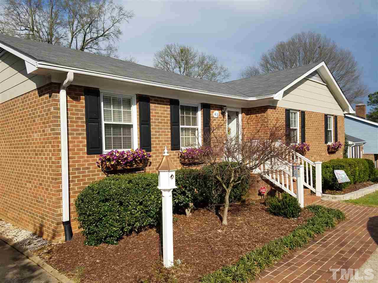 413 East Millbrook Road Raleigh, NC 27609 - Photo 3 of 3 a front view of a house with a yard