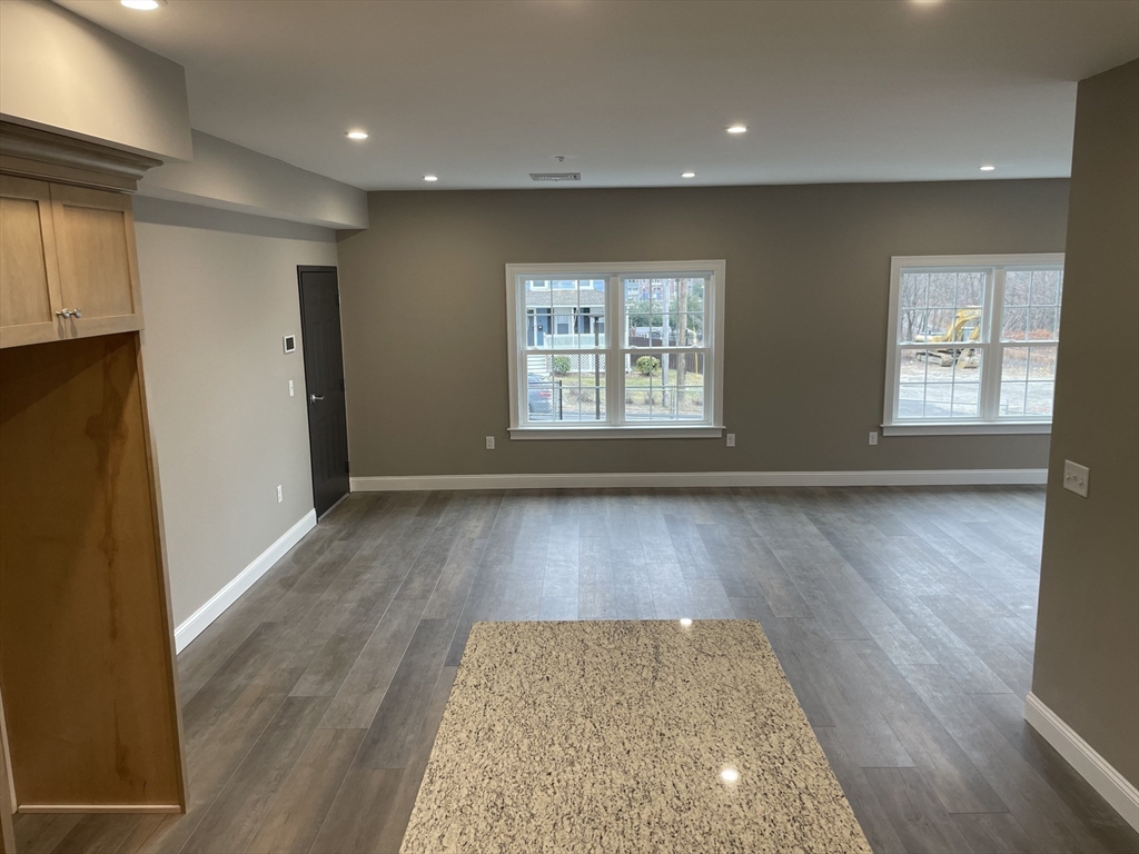 1 Brattle Street, Unit 1 Worcester, MA 01606 - Photo 8 of 21 an entryway with wooden floor and cabinets