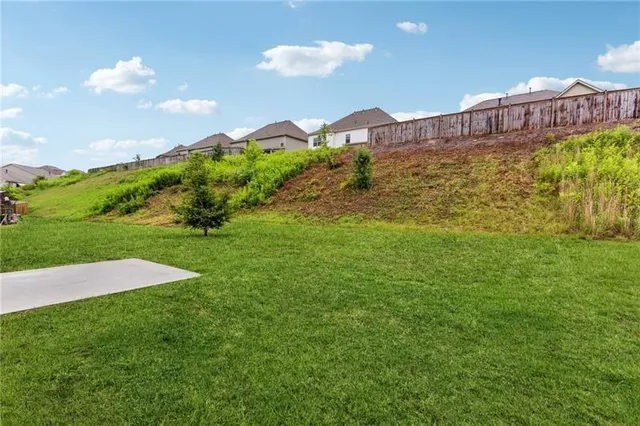 a view of a large building with a yard