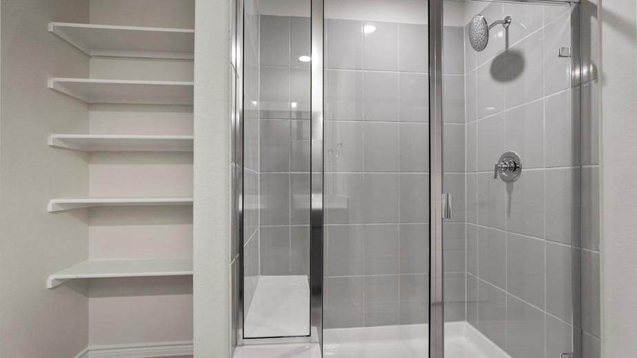 439 Epiphany Lane Lavon, TX 75166 - Photo 16 of 31 Glass-enclosed shower with subway tile surround and integrated shelving unit
