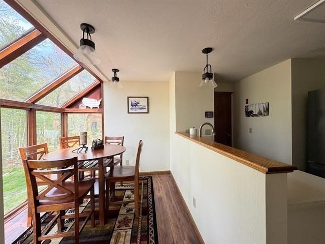 43 West Meadow Road, Unit 43 Haverhill, MA 01832 - Photo 15 of 42 a view of a dining room with furniture window and wooden floor