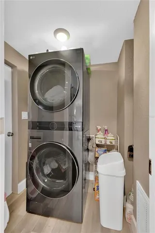 a living room with furniture and a washer dryer