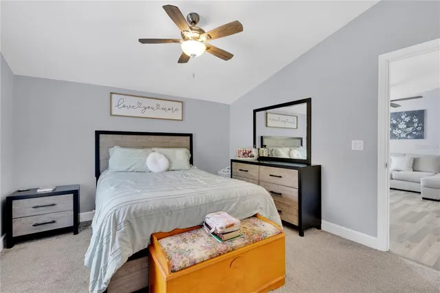 a bedroom with a bed and a tv