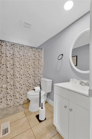 a bathroom with a toilet and a sink