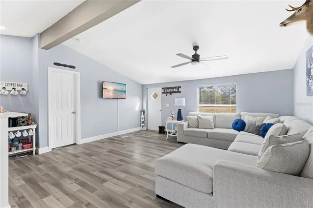 a living room with furniture and a window