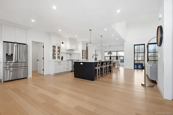 a kitchen with stainless steel appliances refrigerator microwave and stove