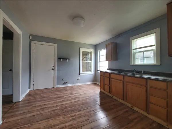 a view of a backyard with a plants and trees