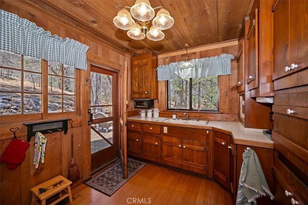 22 Polique Canyon Road Fawnskin, CA 92333 - Photo 12 of 42 Full kitchen and door to backyard mountain
