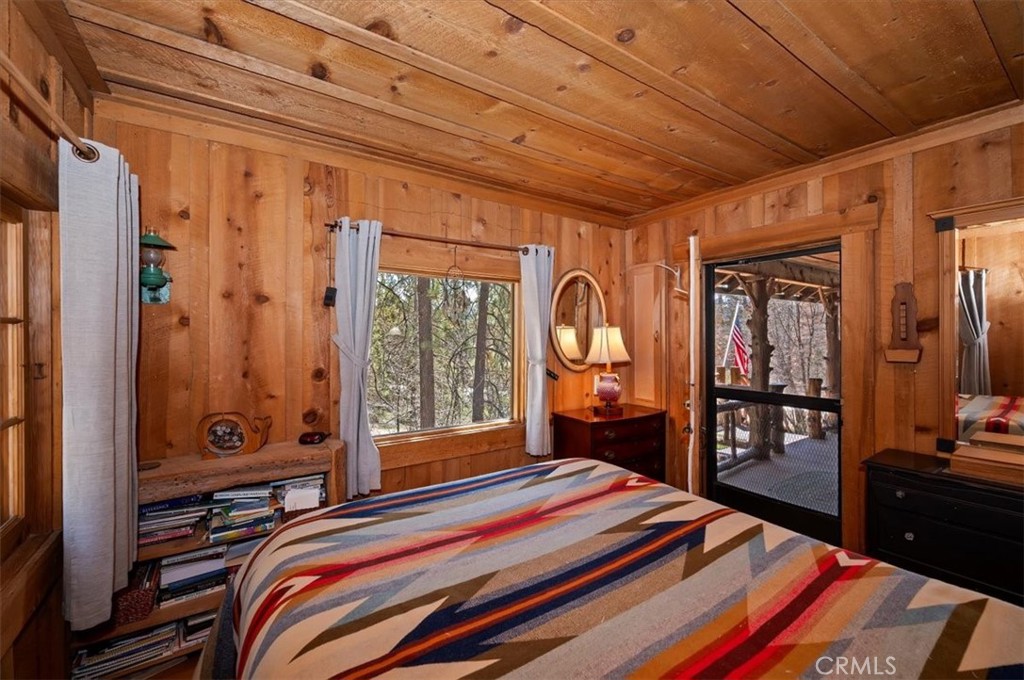 22 Polique Canyon Road Fawnskin, CA 92333 - Photo 18 of 42 Bedroom with forest views