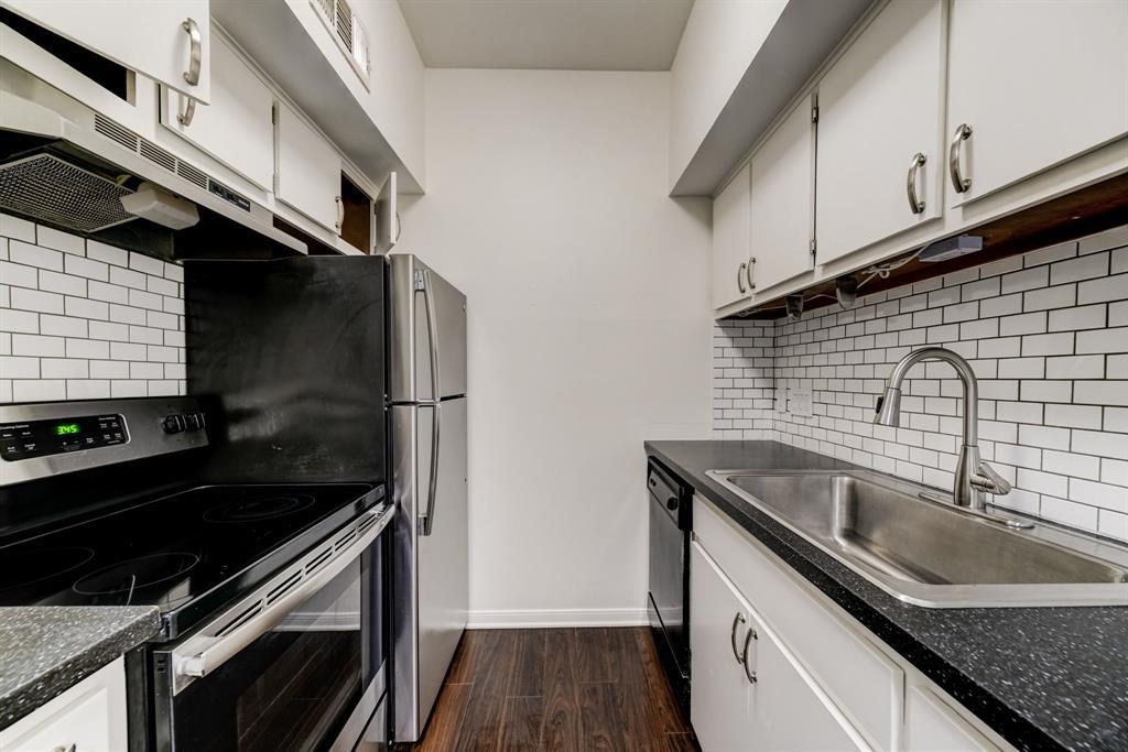 3316 Guadalupe Street, Unit 219 Austin, TX 78705 - Photo 2 of 13 a kitchen that has a sink and a stove