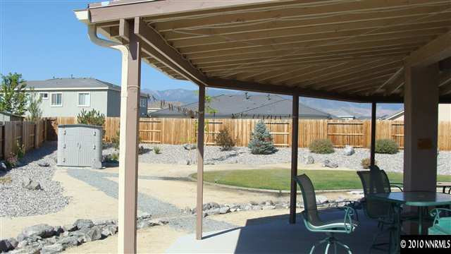 10545 Dillingham Drive Reno, NV 89521 - Photo 8 of 9 a room with furniture and large windows